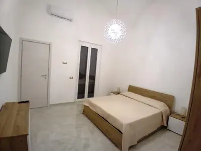 Letto o letti in una camera di casa Mariel