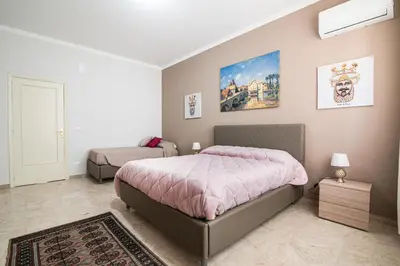 Letto o letti in una camera di StesicoROOM