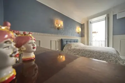 Letto o letti in una camera di Etna Agathae Suite
