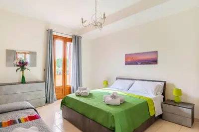 Letto o letti in una camera di La dimora sullo jonio