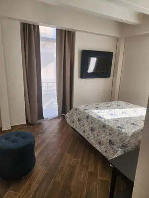 Letto o letti in una camera di Palazzo Grecale Dell'Etna