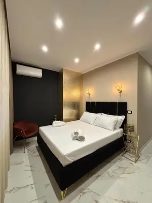 Letto o letti in una camera di Le Suites del Corso Catania Centro
