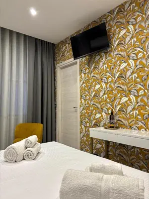 Letto o letti in una camera di Le Suites del Corso Catania Centro