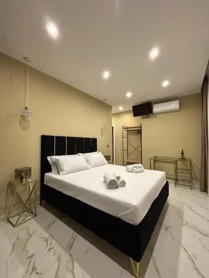 Letto o letti in una camera di Le Suites del Corso Catania Centro
