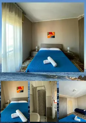 Letto o letti in una camera di Don Pedro Rooms Riposto
