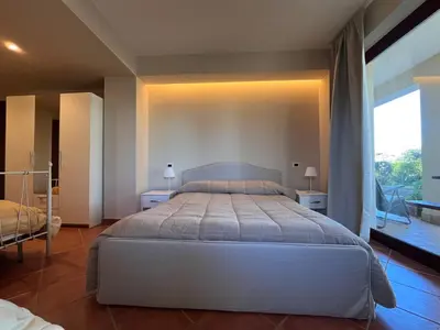 Letto o letti in una camera di Etna tra le Querce