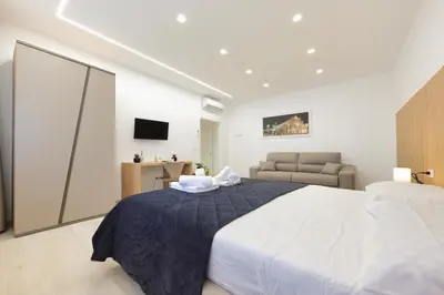 Letto o letti in una camera di Suite del Corso Sicilia