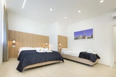 Letto o letti in una camera di Suite del Corso Sicilia