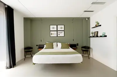 Letto o letti in una camera di Villa Monterosso, Acicastello