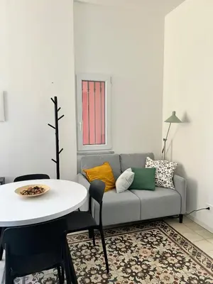 Area soggiorno di Sunshine Apartment Acireale