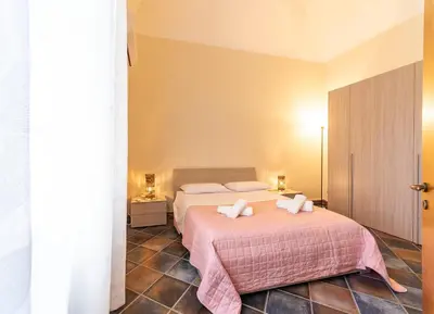 Letto o letti in una camera di Casa Vacanze Catania - Giarre Etna D'Amore