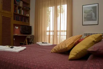 Letto o letti in una camera di La Cittadella Residence Città Universitaria Policlinico Catania
