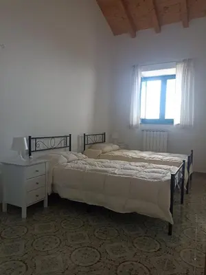 Letto o letti in una camera di Casa Agrumeto in Nunziata