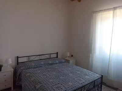 Letto o letti in una camera di Casa Agrumeto in Nunziata