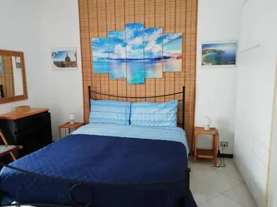 Letto o letti in una camera di Casa Le Ancore