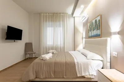 Letto o letti in una camera di GuestHost - Lovely Apartments in Borgo Sanzio - M Giuffrida&Italia