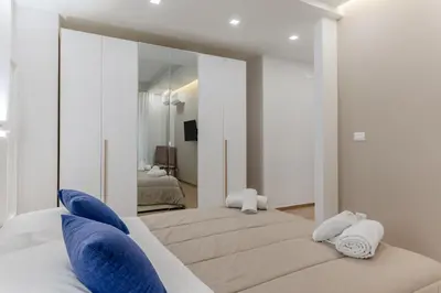 Letto o letti in una camera di GuestHost - Lovely Apartments in Borgo Sanzio - M Giuffrida&Italia