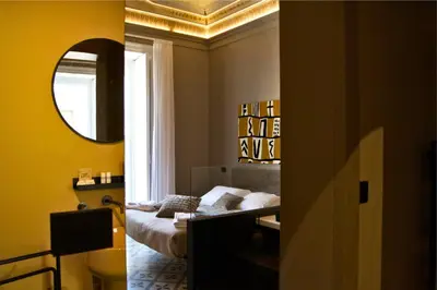 Letto o letti in una camera di L'Opificio Siciliano Boutique Apartments