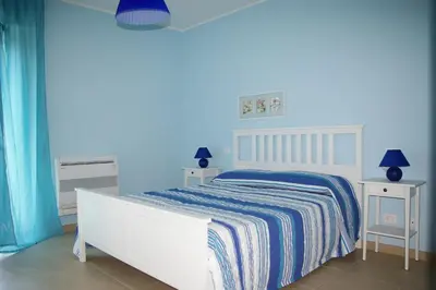 Letto o letti in una camera di Marigrè Bella casa vacanze