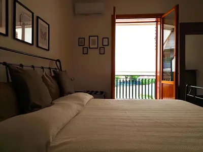 Letto o letti in una camera di Casa Luce Santa Tecla Apartment