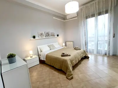 Letto o letti in una camera di Alis Living Apartment - Quadrilocale ampio a Catania