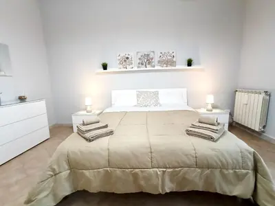 Letto o letti in una camera di Alis Living Apartment - Quadrilocale ampio a Catania
