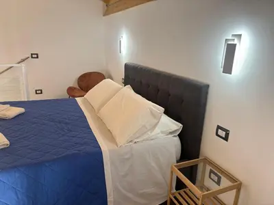 Letto o letti in una camera di Cortiletto Pavone A