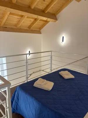 Letto o letti in una camera di Cortiletto Pavone A