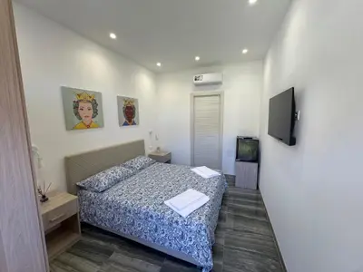 Letto o letti in una camera di Casa Calipso