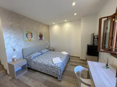 Letto o letti in una camera di Casa Calipso