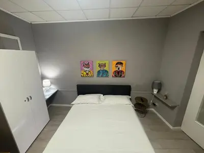 Letto o letti in una camera di Casa Rita Standard Room