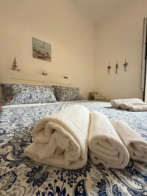 Letto o letti in una camera di Casa Nerina
