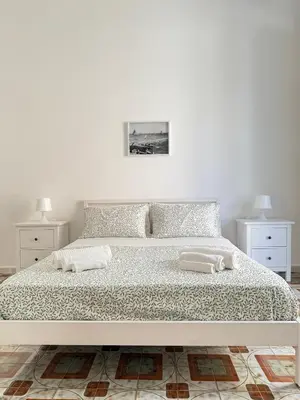 Letto o letti in una camera di Casa Nerina