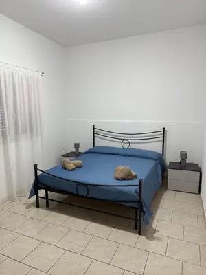 Letto o letti in una camera di Casa Marconi