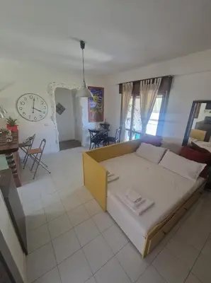 Letto o letti in una camera di Akis, terrazza sul mare