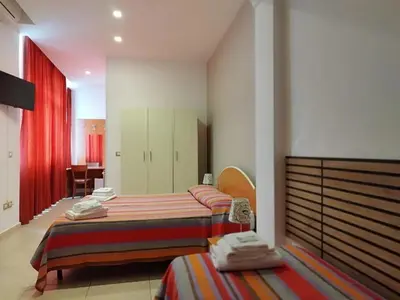 Letto o letti in una camera di B&B Villa Martoglio
