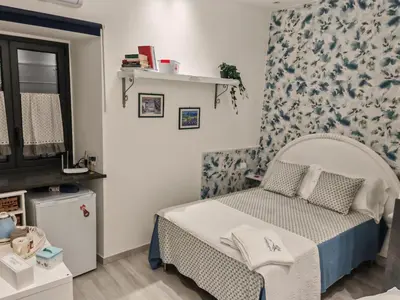 Letto o letti in una camera di DOMUS ULIVI LUXURY ROOMS Moresca