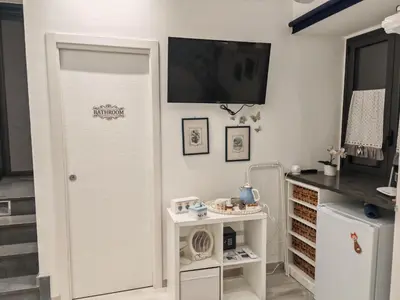 Cucina o angolo cottura di DOMUS ULIVI LUXURY ROOMS Moresca