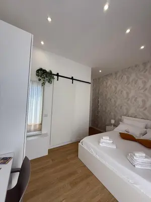 Letto o letti in una camera di Clemente house Catania centro CHIC