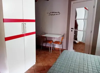 Area soggiorno di Casa Happy - La mansarda del sorriso con parcheggio privato a Valcorrente