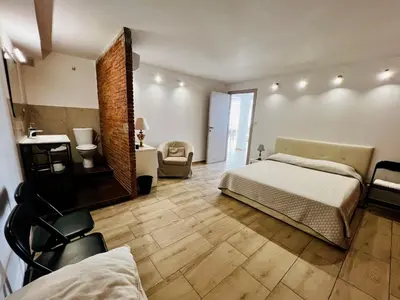 Letto o letti in una camera di Domus Apartment in villa, swimming pool and private parking