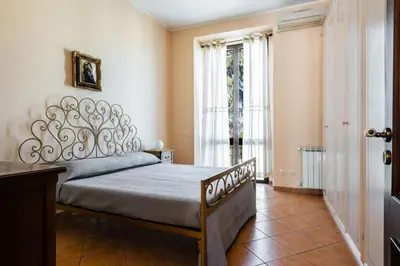 Letto o letti in una camera di Casa Zafferana centro con terrazza