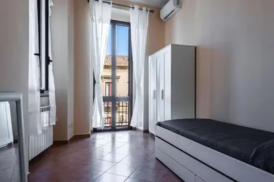 Letto o letti in una camera di Casa Zafferana centro con terrazza