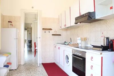 Cucina o angolo cottura di 'ETNA HOME' 400mt SEA - Airport - Taormina & Netflix