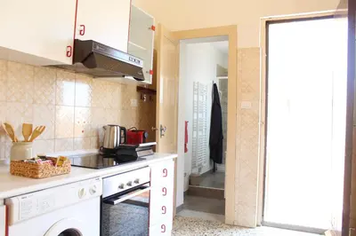 Cucina o angolo cottura di 'ETNA HOME' 400mt SEA - Airport - Taormina & Netflix