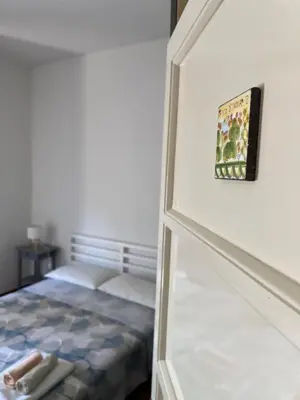 Letto o letti in una camera di L'alloggio dell'Ingegnere