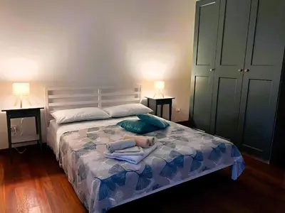 Letto o letti in una camera di L'alloggio dell'Ingegnere