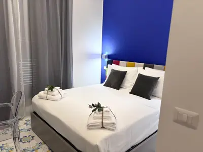Letto o letti in una camera di Ognissanti Rooms