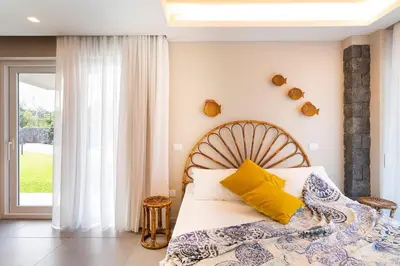 Letto o letti in una camera di Villa Geranio