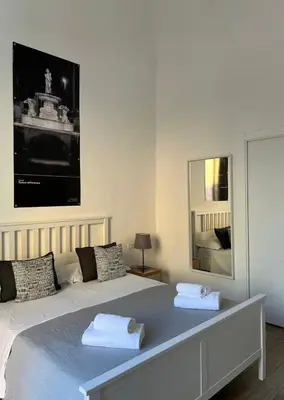 Letto o letti in una camera di Qori Sicilian Stay
